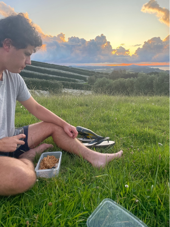 A man drinking wine and eating dinner 