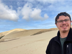 a man taking a selfie on Te Paki Sand Dunes
